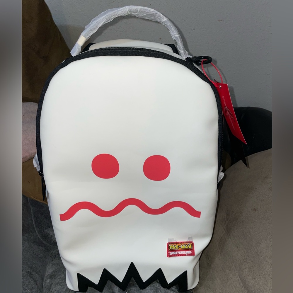 RARE LIMITED EDITION Sprayground/ PAC-Man White/ Glow in the Dark backpack.